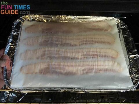 baking-bacon-on-parchment-paper (1) The secret is to cover the bacon with parchment paper to eliminate 100% of the grease splatter!