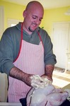 Jim buttering up to the turkey before he cooks it.
