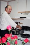 Jim whipping up some special dinner surprise  in my Orlando apartment.