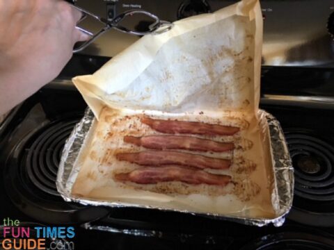 Open up the parchment paper and let it rest until the bacon stops sizzling.