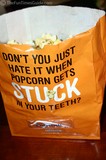 A popcorn bag with a built-in flosser!